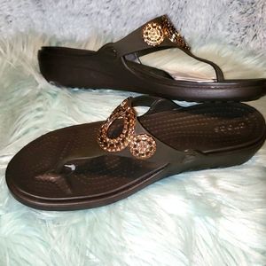 Crocs brown wedges sandals.